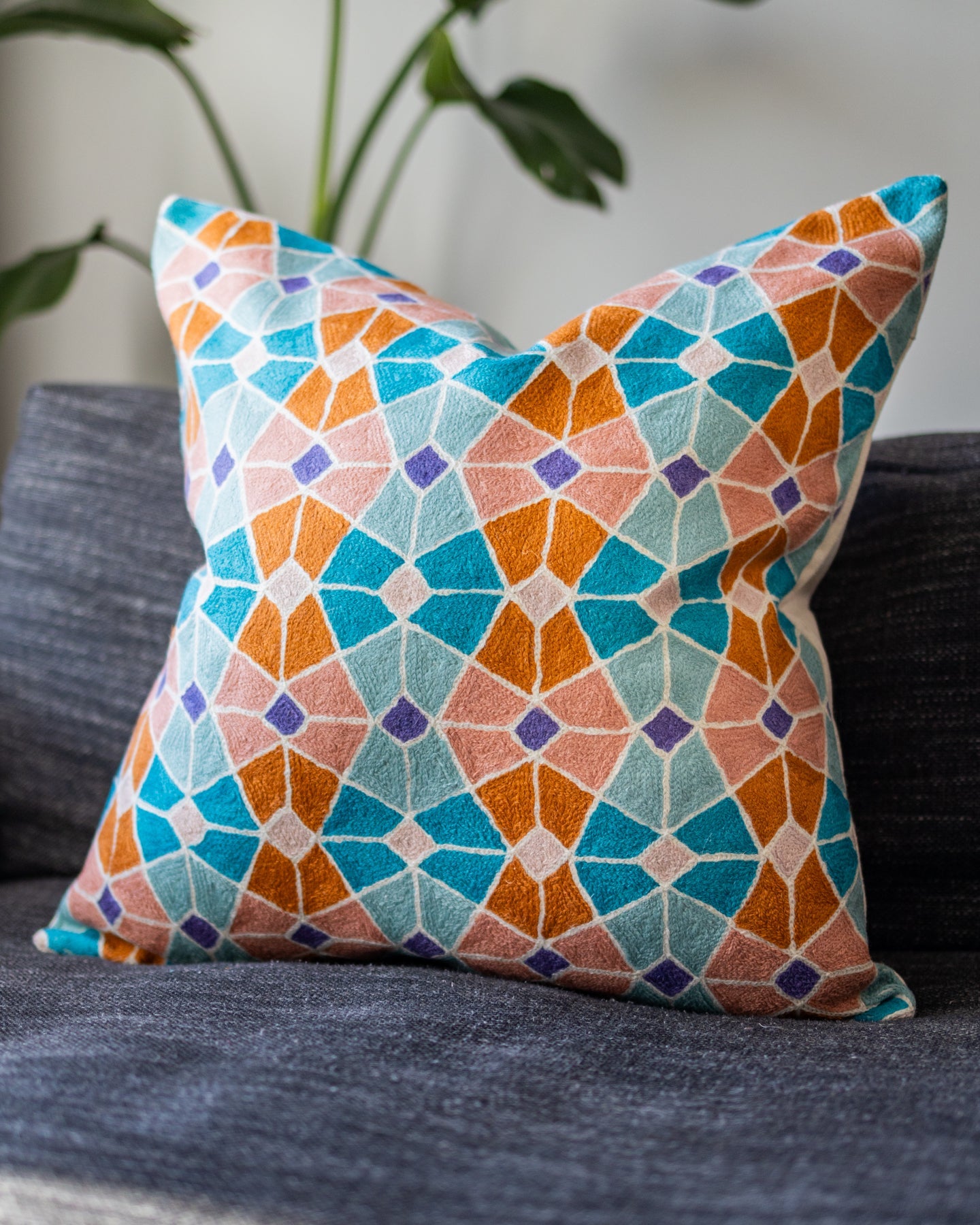 Teal shops and orange throw pillows